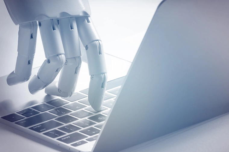 AI Robot hand on keyboard